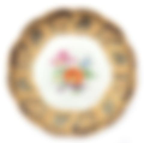 A porcelain charger with a gilt cobalt blue rim and a central decoration of wild flowers (preview)