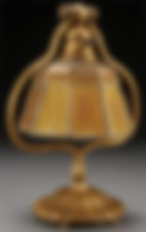 A TIFFANY STUDIOS ETCHED DORE BRONZE AND FAVRILE GLASS “LINEN FOLD” PIANO LAMP (preview)