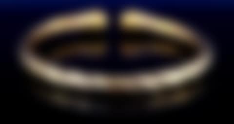 An Italian 18ct hollow gold twist sprung bangle (preview)