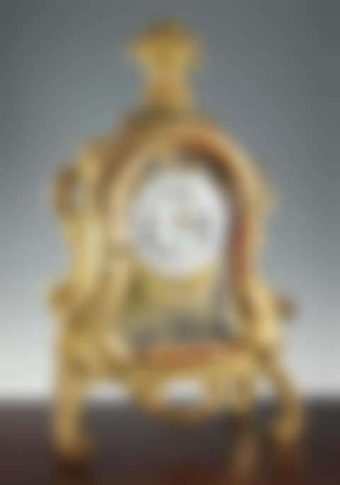 A mid 18th century German carved giltwood striking and chiming mantel clock (preview)