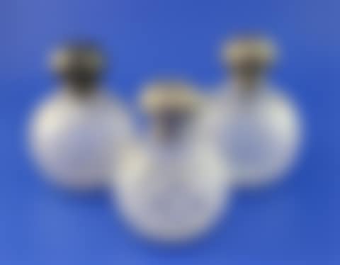 Three early 20th century silver lidded cut glass globular scent bottles (preview)