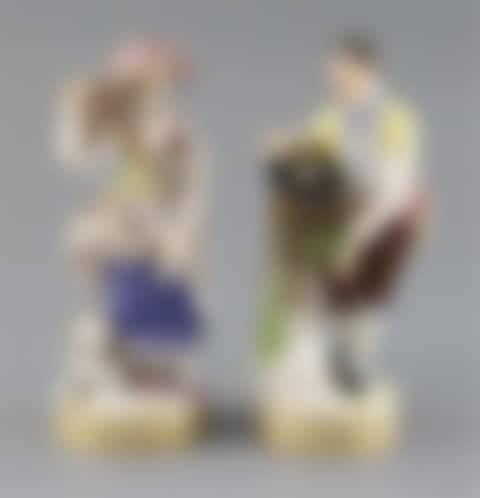 Two Meissen figures of a boy with a bird nest and girl with a bird cage (preview)