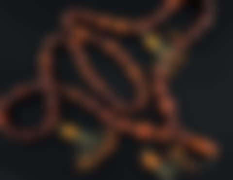 A Persian gilt metal and graduated amber bead tassel drop necklace (preview)